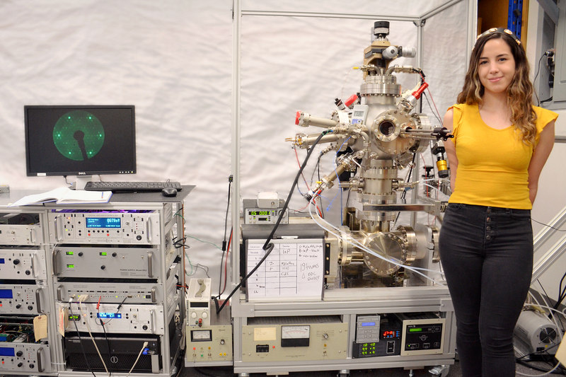 Technical Engineering Assistant at OCI Vacuum Microengineering Inc., in the lab, next to OCI VM's UHV spectroscopy system.